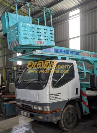 Man Lifting Bucket for Rent in Sri Lanka